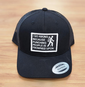 I Go Hiking Because Punching People Is Frowned Upon patched Black Trucker hat